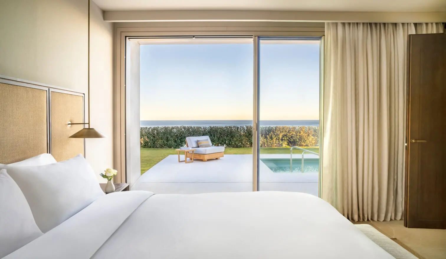 Fairmont La Hacienda bedroom opening to a private garden and pool